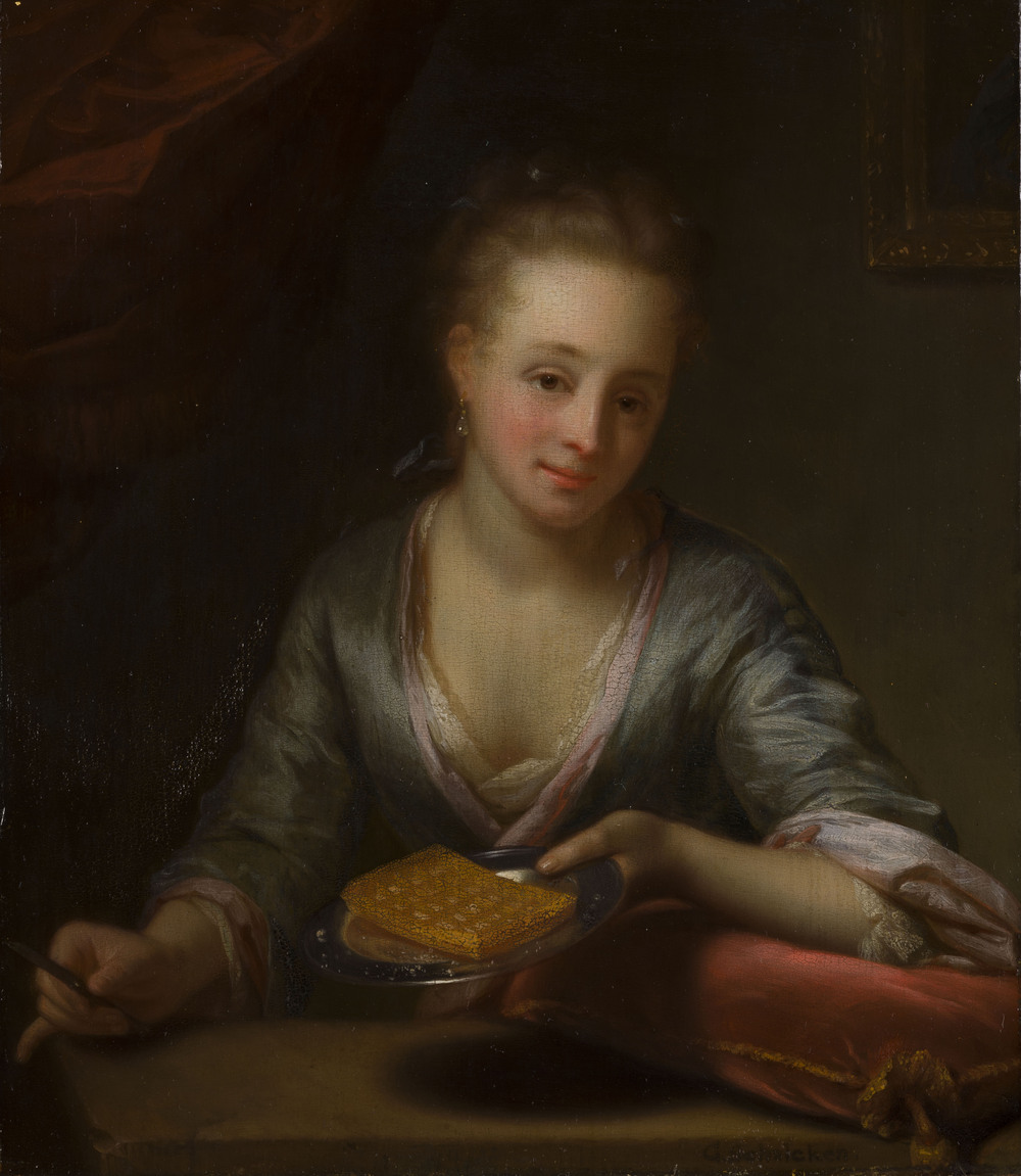 A lady holding a plate with a waffle