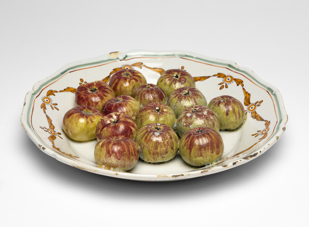 Trompe l’oeil plate of fruit (possibly figs)