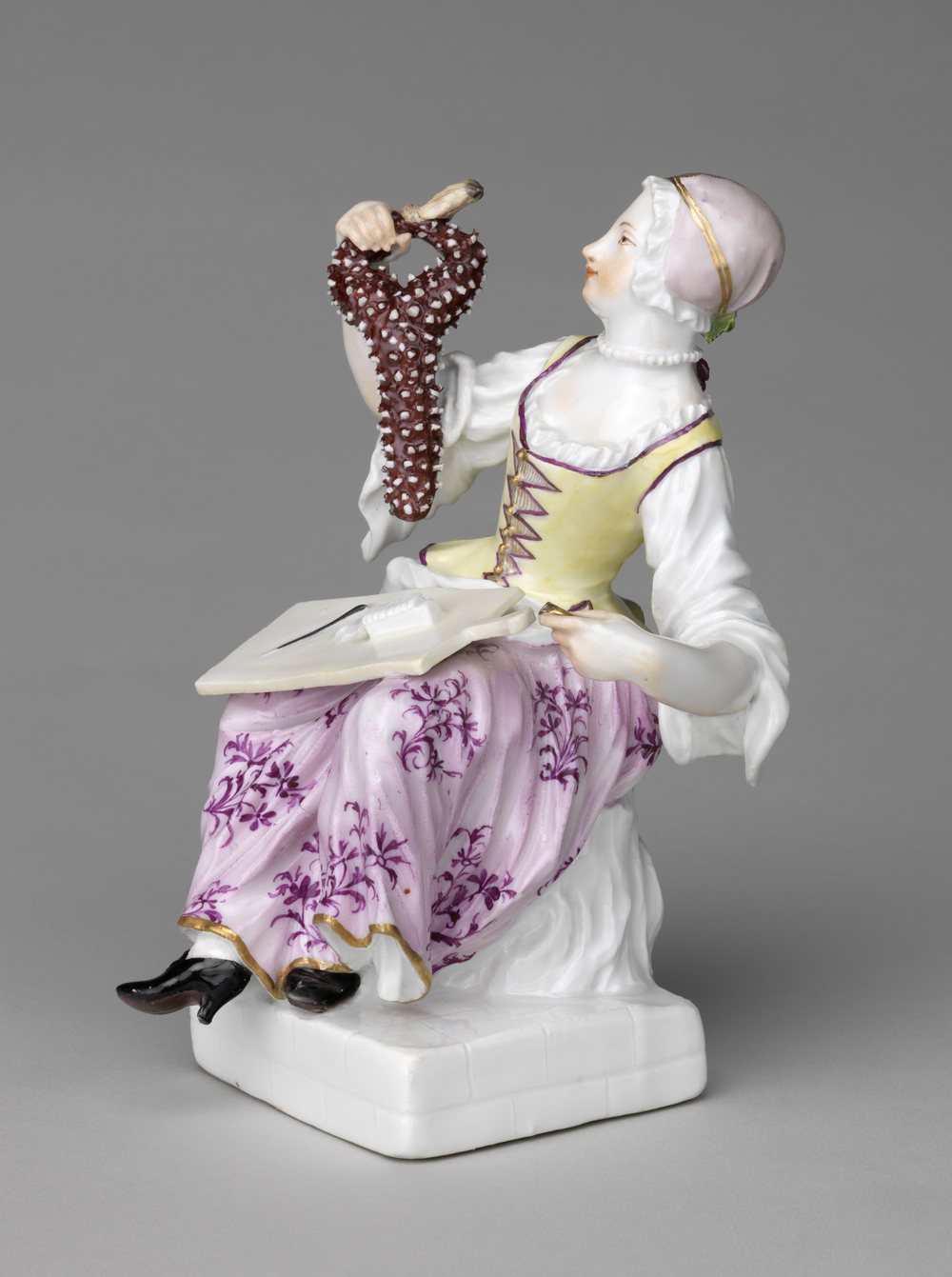 Female cook holding a larded hare Meissen Porcelain Factory